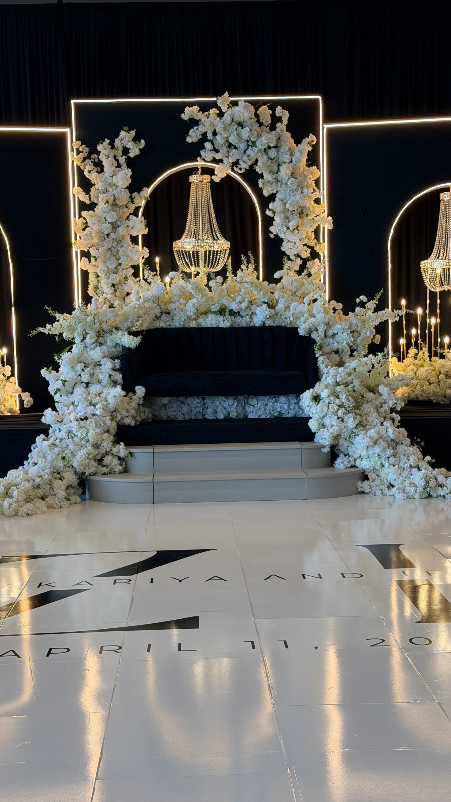 Wedding floral arch with chandeliers